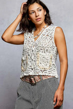 White lace sleeveless pol button cropped crochet vest with floral patterns beaded embellishments and scalloped edge