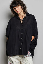 Black oversized button-down shirt with relaxed fit and subtle texture featuring half dolman sleeves from pol
