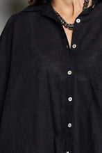 Black linen dolman sleeve shirt with white buttons and collar featuring half dolman sleeve design