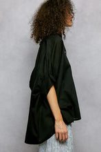 Black oversized half dolman sleeve shirt with loose flowing sleeves and relaxed fit for casual wear