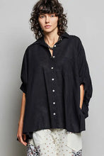 Black oversized button-down shirt with half dolman sleeves and rolled-up cuffs for a relaxed fit by POL