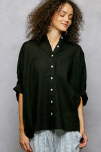 Black half dolman sleeve button down shirt with white buttons and rolled sleeves in lightweight fabric