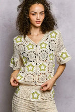 Cream crochet V-neck cardigan with sage green star motifs, relaxed fit