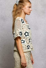 Cream crochet cardigan with POL button, V-neck, black star motifs