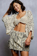 Cream-colored crochet knit lightweight cardigan with square neckline