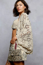 Cream-colored crochet knit lightweight cardigan, loose fit, button closure