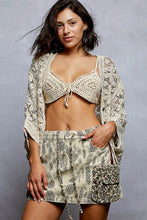 Cream-colored crochet knit lightweight cardigan with lace pattern