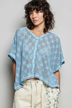 Light blue crochet lace short sleeve top with v-neck made of open-knit lace for elegant casual wear