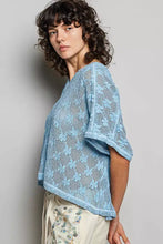 Light blue crochet lace short sleeve top with v-neck and flutter sleeves in intricate crochet lace design