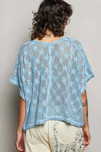 Light blue crochet lace short sleeve top with open-knit design and relaxed fit from pol collection