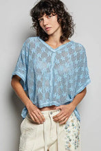 Light blue crochet lace short sleeve v neck top with open knit pattern from pol collection