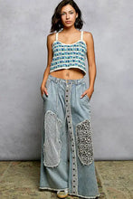 Light-wash denim wide-leg pants with patchwork panels and buttoned placket paired with scalloped edge crochet cami