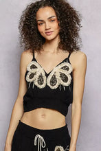 Black cami tank with white lace butterfly appliqués featuring pol embroidered fringe v neck design