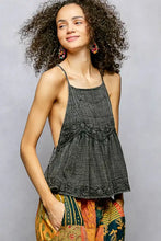 Black textured halter top with lace detailing and flared hem featuring adjustable shoulder straps pol embroidered square neck cami