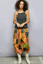 Patchwork harem pants in vibrant orange green and navy paired with pol embroidered square neck cami with adjustable shoulder straps