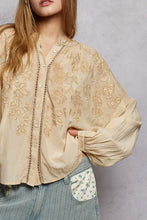 Beige long sleeve blouse with pol embroidery button down front and ruffled sleeves in a washed fabric