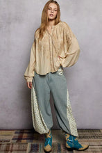 Beige embroidered long sleeve blouse with loose flowing sleeves and pol embroidery button down front in washed fabric