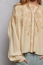 Beige long sleeve blouse with pol embroidery button detailing, delicate lace, and puffed sleeves in washed fabric