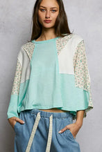 Mint green and white patchwork textured slub knit top with floral patterned sleeves and round neck design
