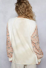 Pol exposed seam star patch thermal top featuring an off-white ribbed body with peach floral long sleeve length