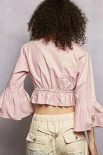 A soft pink POL floral embroidered cropped blouse with flared ruffle sleeves and a ruffled hem