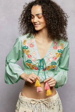 Mint green floral embroidered cropped blouse with colorful floral embroidery and tassel ties for stylish wear