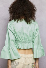 Mint green floral embroidered cropped blouse with flared bell sleeves and gathered waistband perfect for stylish wear