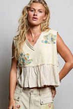 Beige patch ruffled sleeveless top with floral patch embroidery and raw edge detail in lightweight fabric