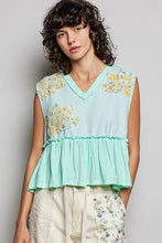 Mint green sleeveless top with yellow floral patch embroidery and raw edge ruffled hem in pol floral patch style