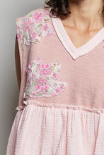 A soft pink floral patch ruffled sleeveless dress with delicate lace appliqués and a gathered waist featuring a v-neckline