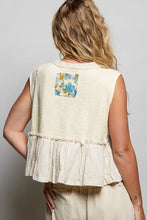 Back view of cream sleeveless top with textured fabric featuring floral patch ruffled hem and raw edge detail