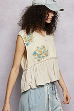 Beige floral patch ruffled sleeveless top with embroidery and raw edge detail perfect for casual wear