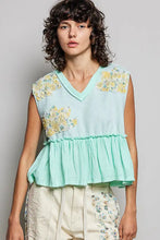 Mint green pol floral patch sleeveless top with yellow embroidery, ruffled hem, and raw edge detail