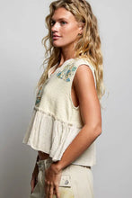 Beige floral patch ruffled sleeveless cropped top with embroidery and raw edge detail suitable for casual wear