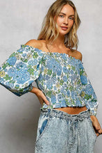 Blue floral pol floral print blouse with smocked bodice and puffed sleeves off-shoulder design