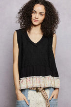 Pol floral print sleeveless black tank with v neck textured knit fabric and pastel floral ruffled hem