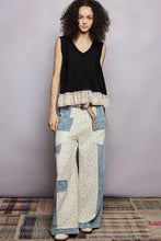 Patchwork denim wide-leg pants with floral pattern and leopard-print belt paired with pol floral print v neck textured tank