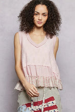 Soft pink pol floral textured tank with sleeveless v-neckline and tiered ruffle hem featuring floral embroidery