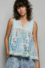 Light blue pol floral sheer tank with sleeveless patchwork design and lace trim along neckline and hem