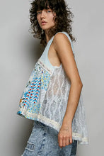 Light blue and white pol floral sheer tank with lace trim featuring a sleeveless patchwork design