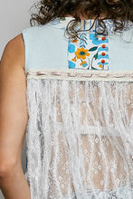 Back view of pol floral sheer tank with light blue ribbed fabric, colorful floral patch, and white lace trim