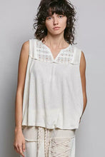 A soft off-white sleeveless top featuring lace detail floral double gauze patch with ribbed fabric body