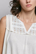 Off-white sleeveless top with lace-trimmed floral neckline made of ribbed double gauze patch fabric by pol