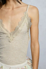 Beige pol lace neck ribbed cami with delicate lace trim and frayed edge detailing for elegant layering