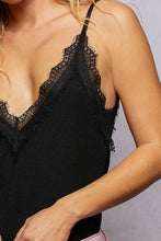 Black pol lace detail v-neck ribbed cami with delicate frayed lace trim along neckline and straps