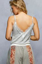 Gray ribbed cami with white lace trim and deep v-back showcasing pol lace detail neck ribbed design