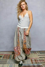 Gray ribbed cami with pol lace trim v-neckline and thin spaghetti straps perfect for layering and casual wear