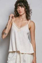 Off-white textured knit cami with lace trim v-neckline and thin spaghetti straps from pol collection