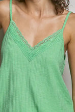 A light green ribbed cotton textured knit cami with lace detail along the v-neckline for elegant layering
