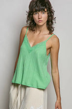 A light green textured knit cami with lace detail along the v-neckline made from ribbed knit fabric